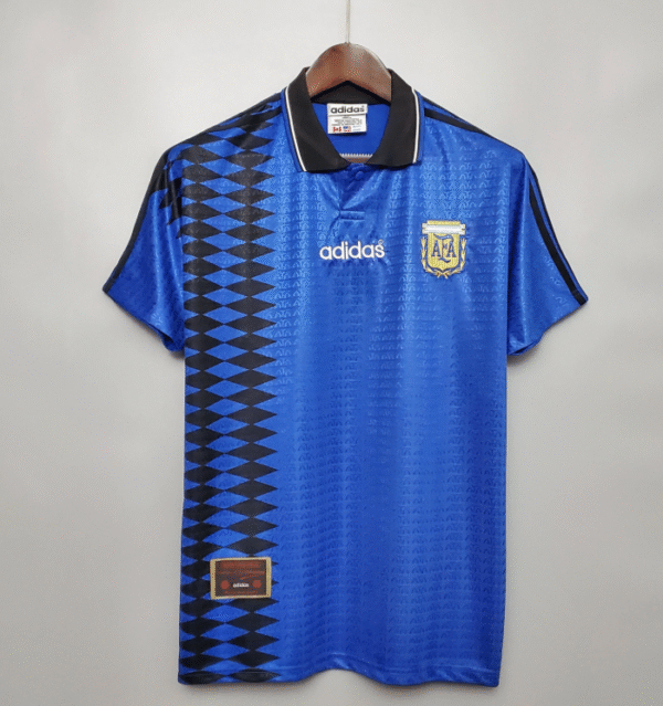 Captura de pantalla 2025-10-01 a la(s) 4.16.35 p.m. Camiseta Argentina 1990 Azul | Maradona vs Italia